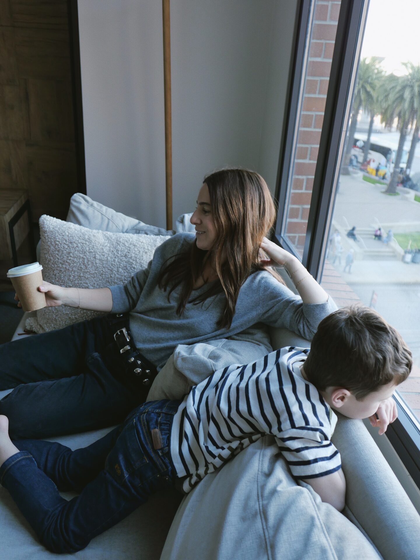 woman and a kid in a couch