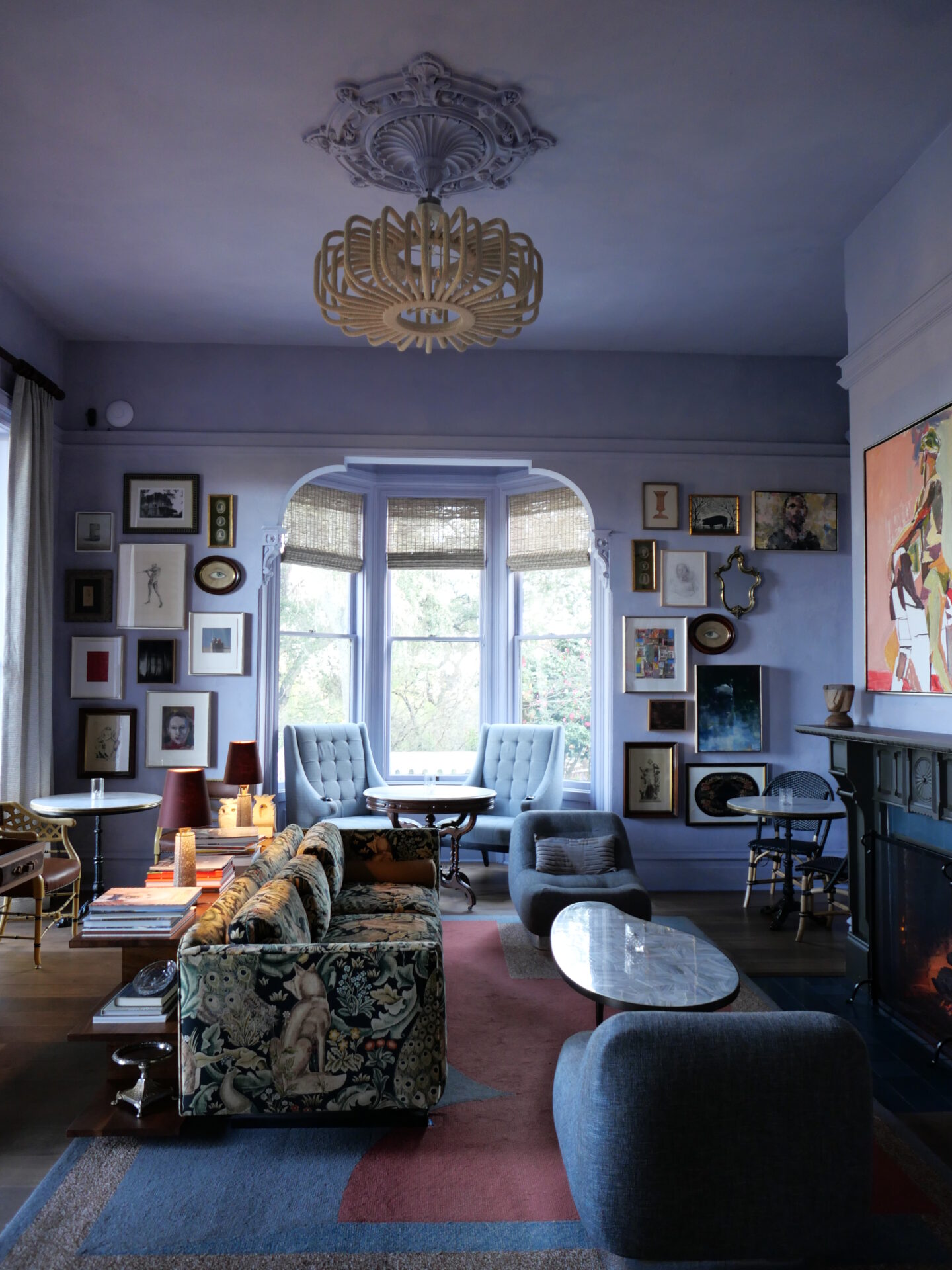 The lounge area at The Madrona Inn is a cozy and inviting space with art-filled walls. 