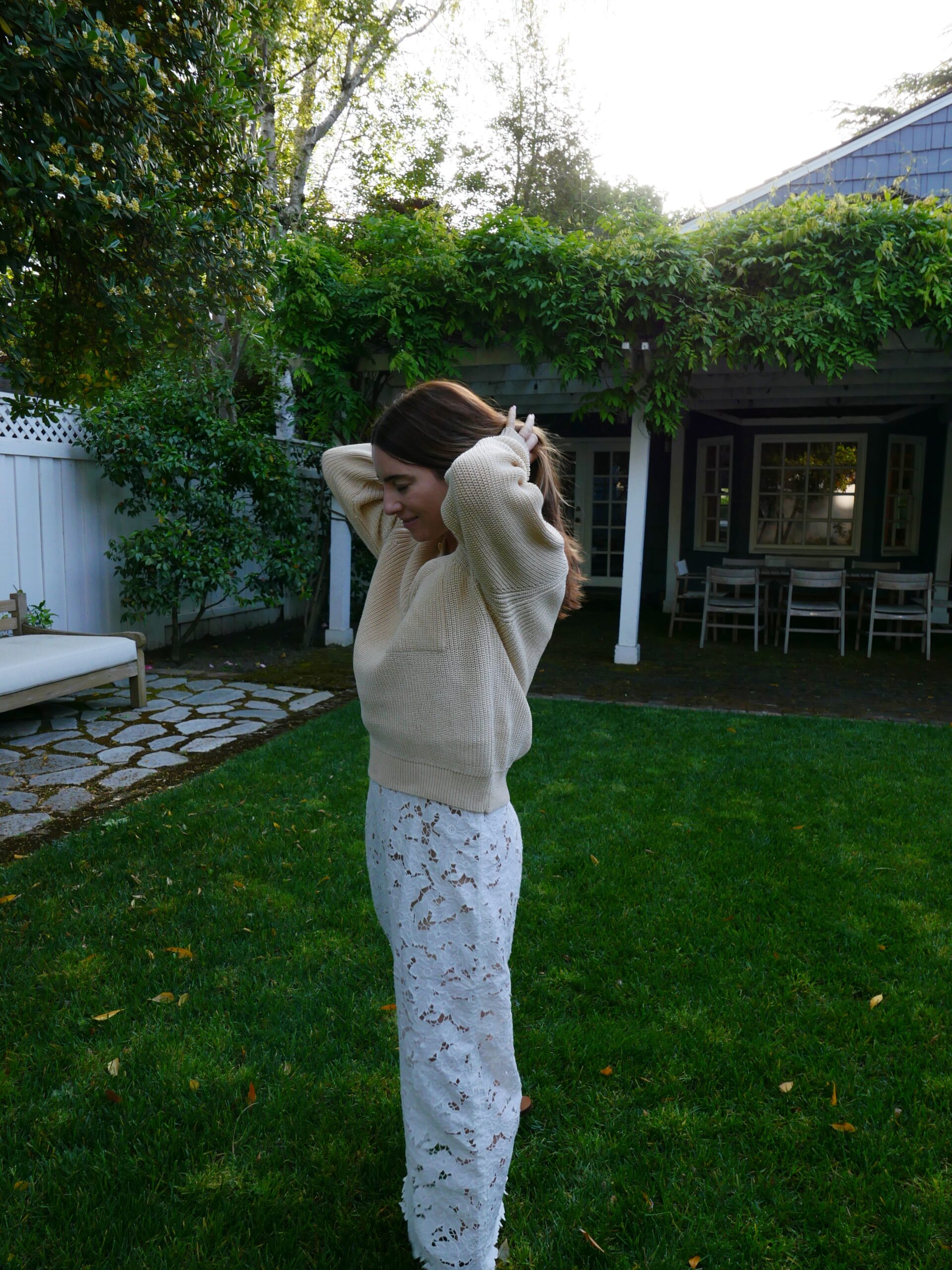 woman tying her hair up