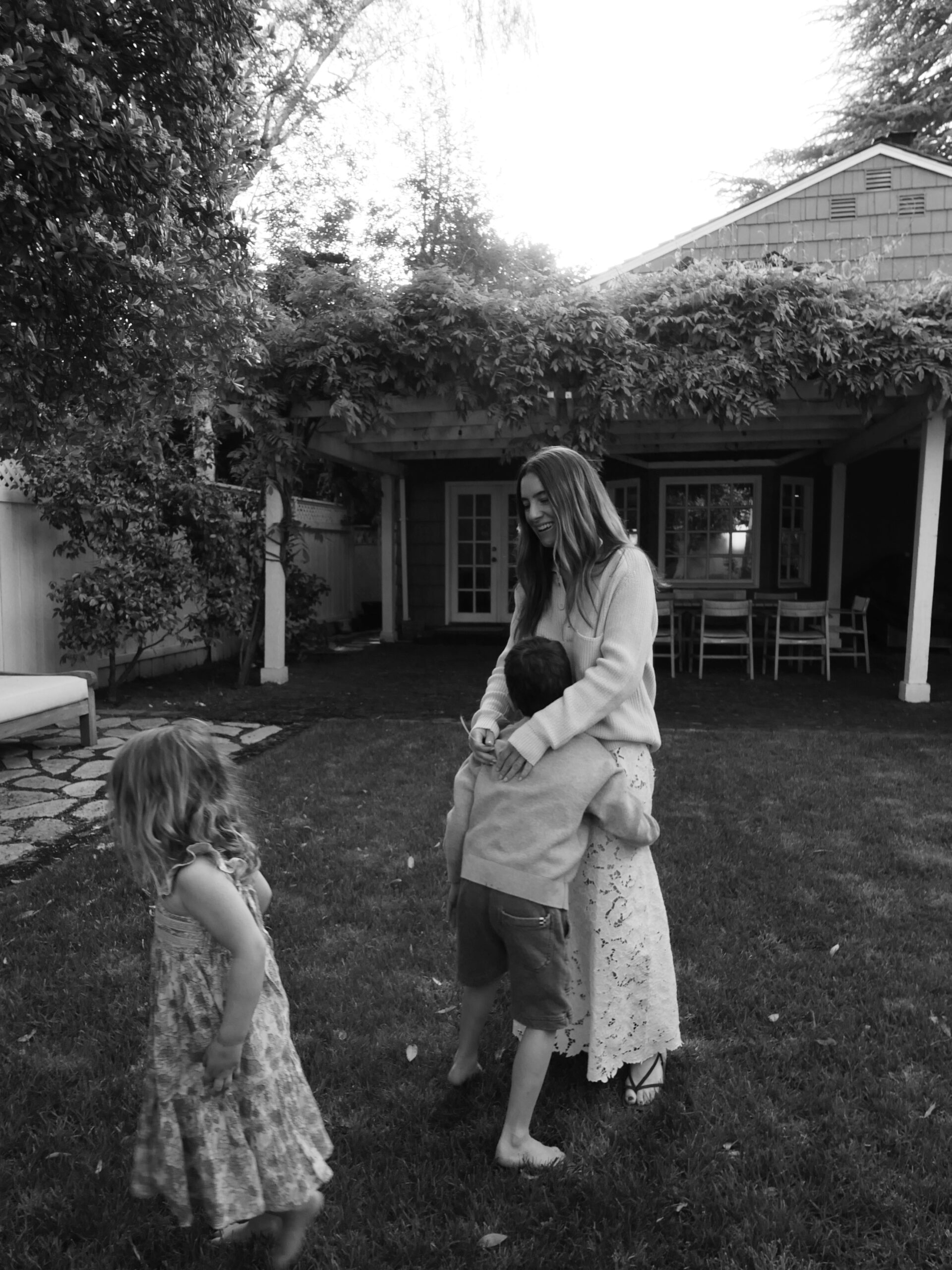 woman playing with her kids