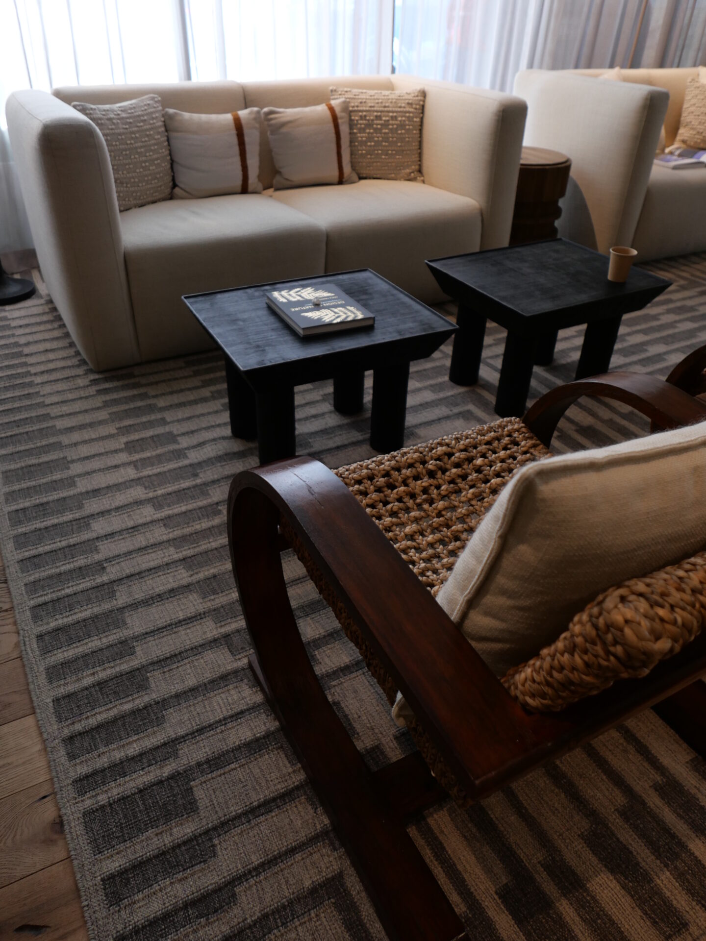 sofa, wooden chair, and coffee table at 1 Hotel San Francisco