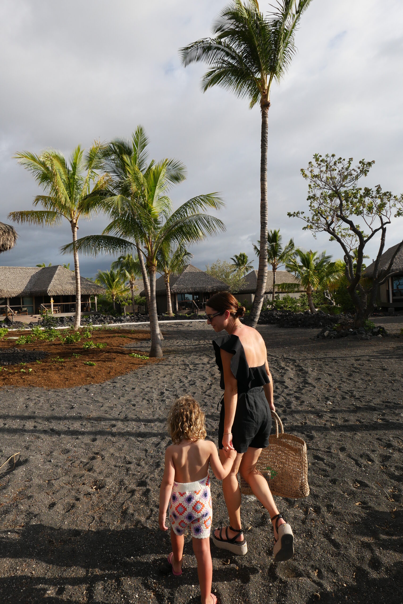 Alicia Lund walking with her child at Kona Village