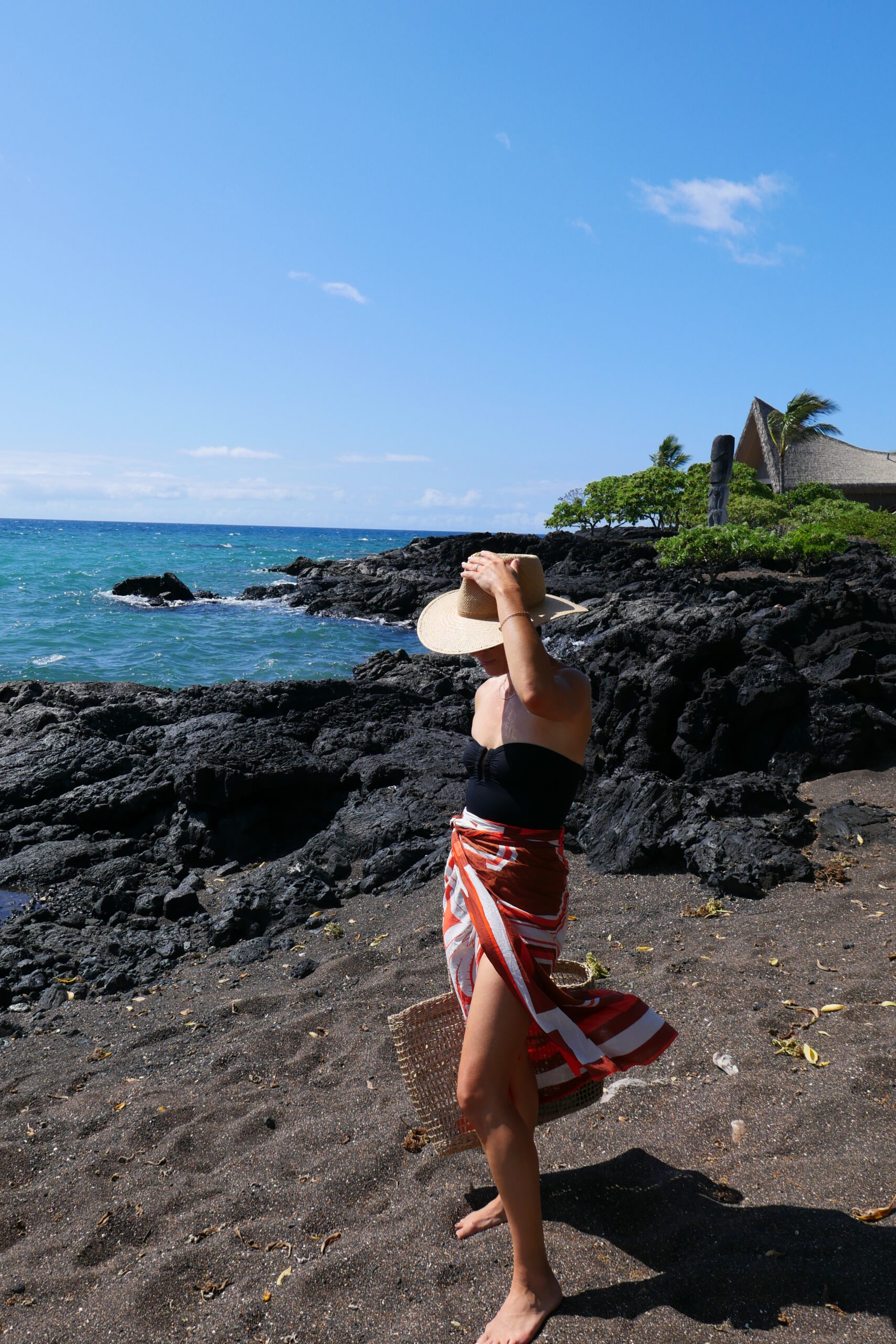 Alicia Lund wearing black swimwear and a wrap skirt