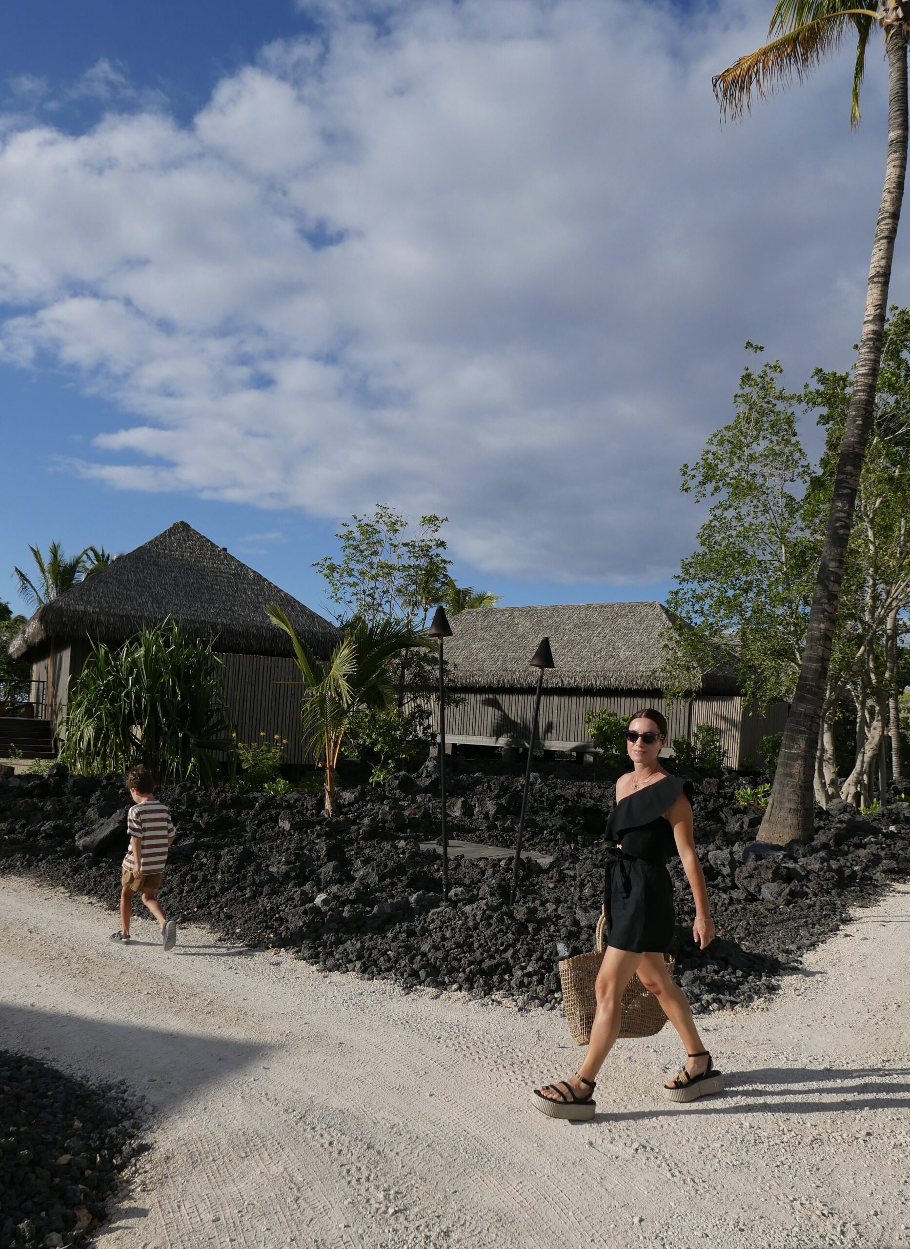 Alicia Lund exploring Kona Village with her kid 